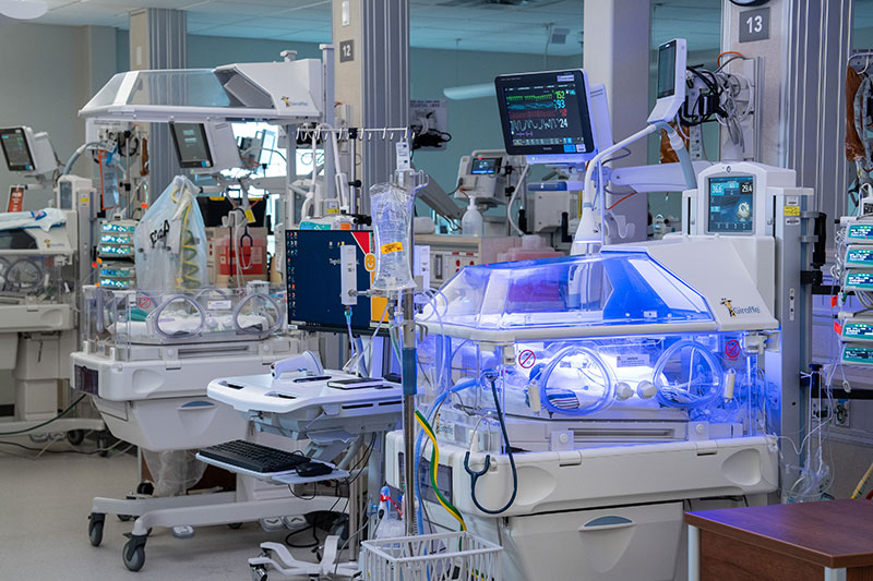 Neonatal intensive care unit with hospital equipment.